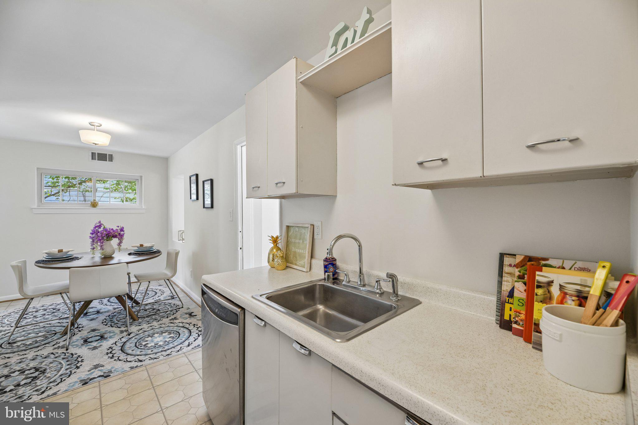 31 South Edison Street Arlington, VA 22204 - Photo 23 of 60 a kitchen with a sink a stove and cabinets