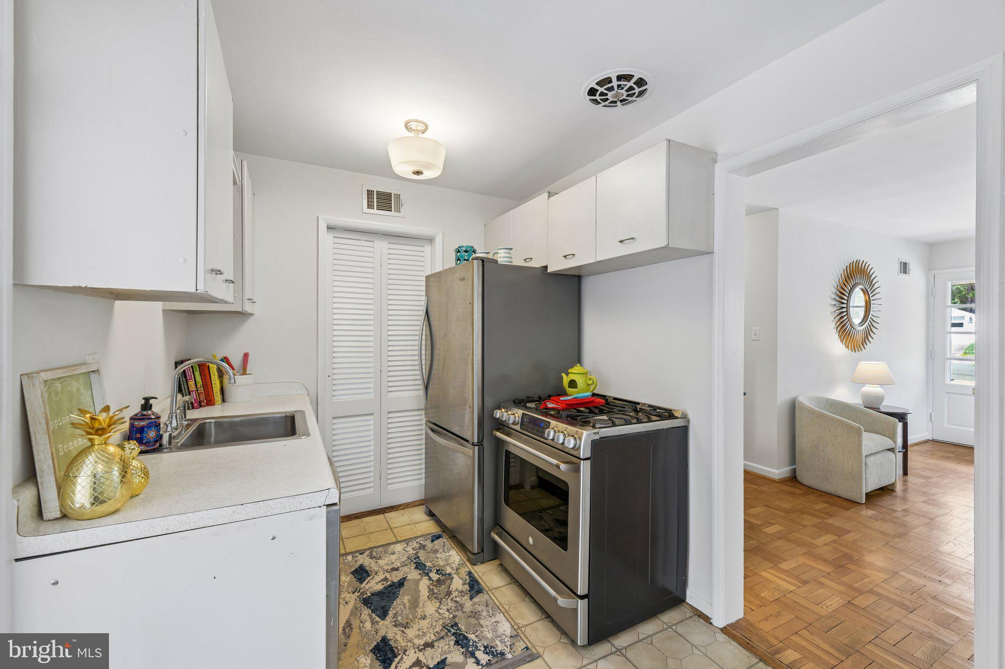 31 South Edison Street Arlington, VA 22204 - Photo 24 of 60 a kitchen with stainless steel appliances a stove a refrigerator and a cabinets