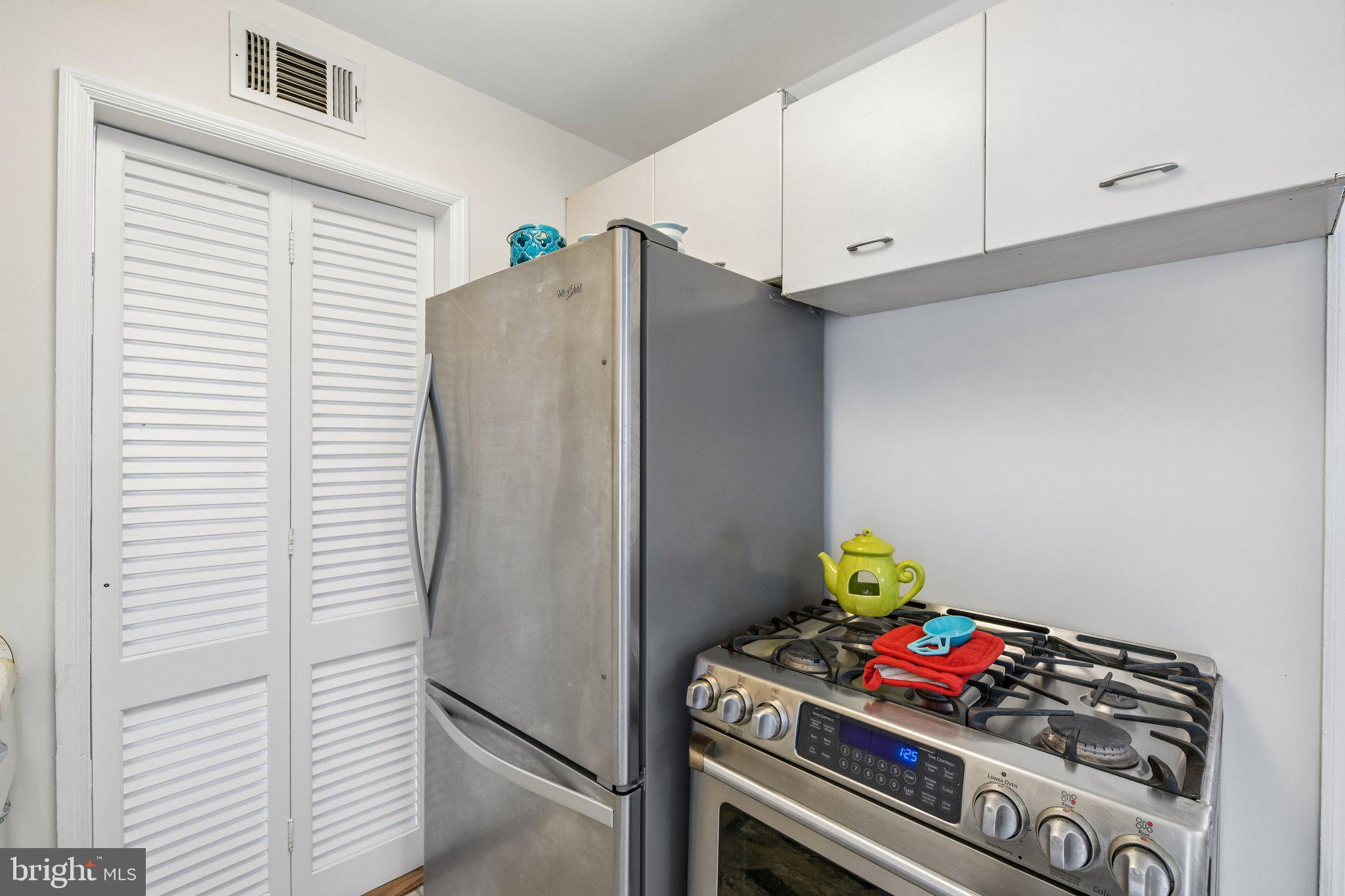 31 South Edison Street Arlington, VA 22204 - Photo 26 of 60 a kitchen with stainless steel appliances cabinets and stove