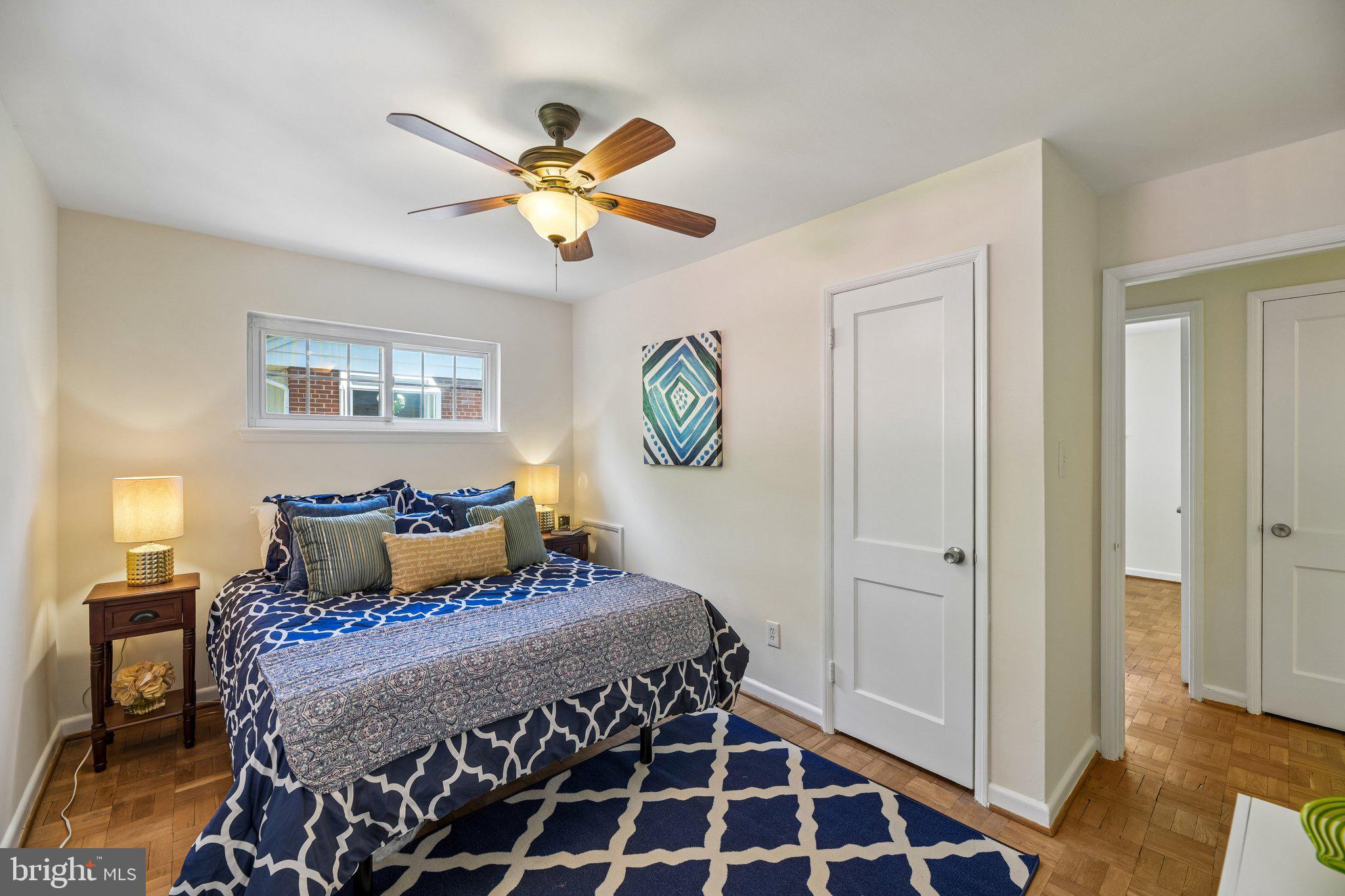 31 South Edison Street Arlington, VA 22204 - Photo 30 of 60 a bedroom with a bed and a chandelier