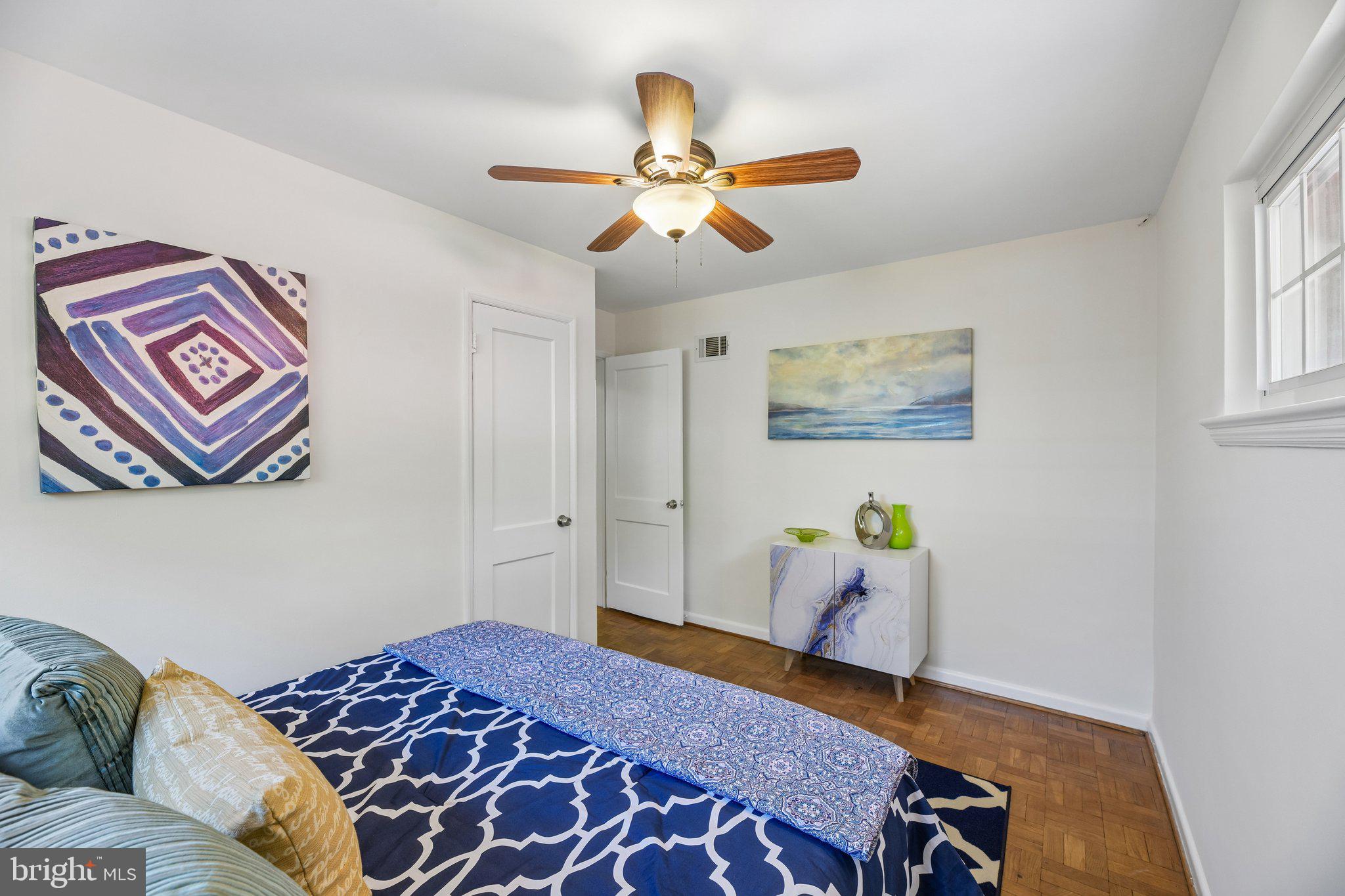 31 South Edison Street Arlington, VA 22204 - Photo 32 of 60 a bedroom with a bed and a chandelier