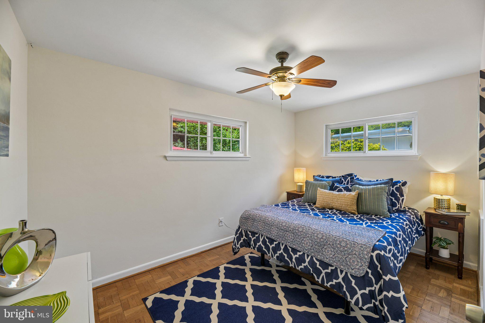 31 South Edison Street Arlington, VA 22204 - Photo 34 of 60 a bedroom with a bed and wooden floor