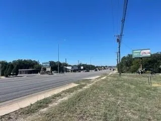 a view of a road with a yard