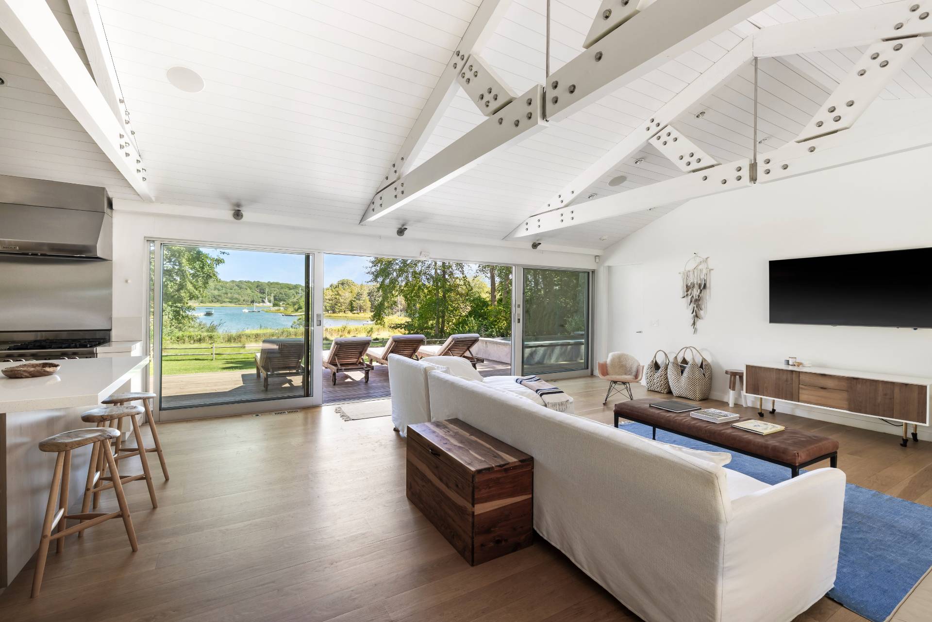 26 Oyster Shores Road East Hampton, NY 11937 - Photo 7 of 17 a living room with furniture and a flat screen tv