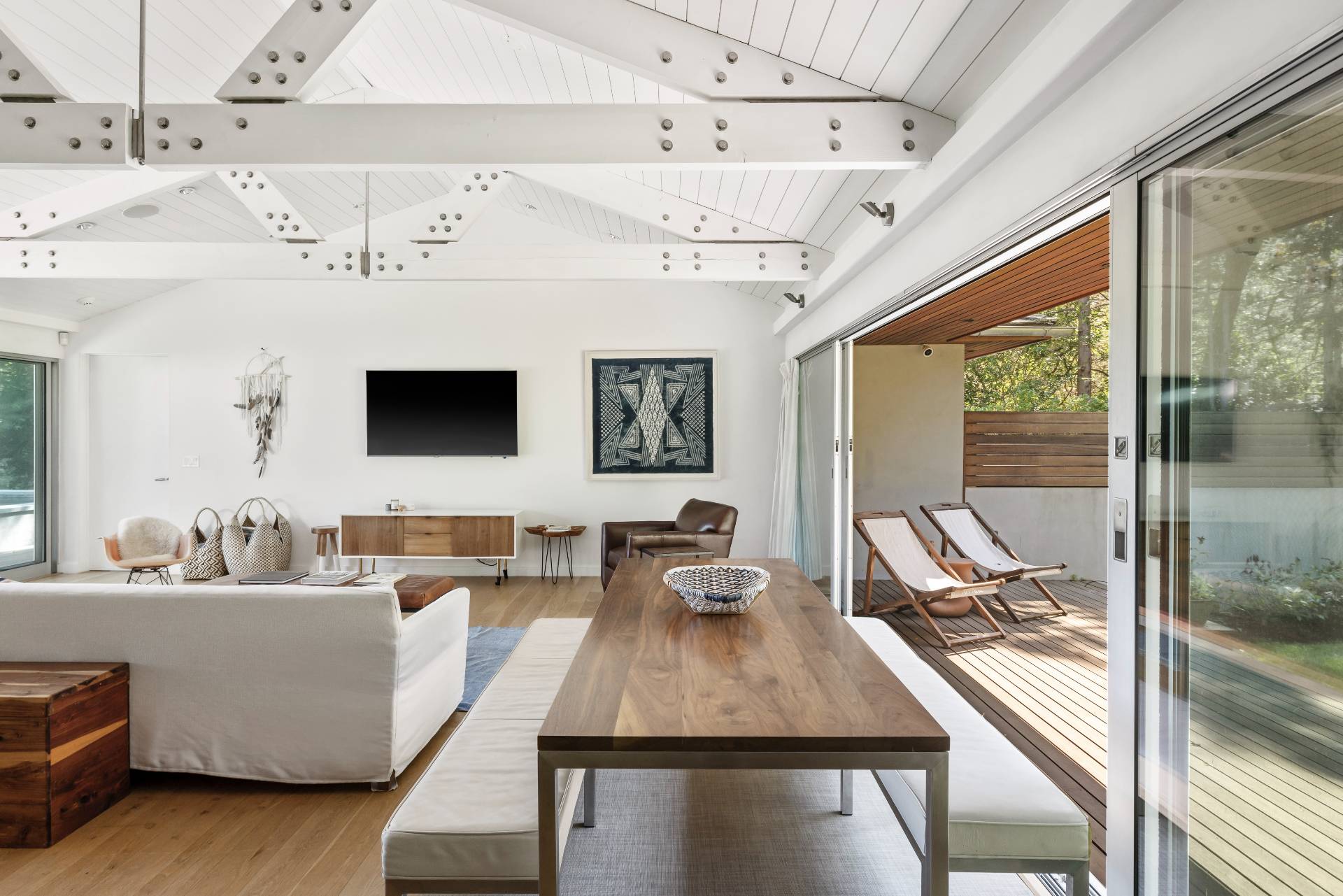 26 Oyster Shores Road East Hampton, NY 11937 - Photo 9 of 17 a living room with furniture and a flat screen tv