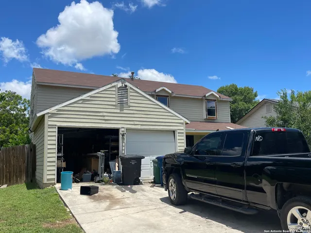 a view of a car park in front of house