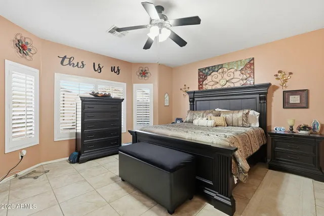 a bedroom with a bed dresser and a window