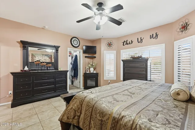 a bedroom with a bed and a dresser