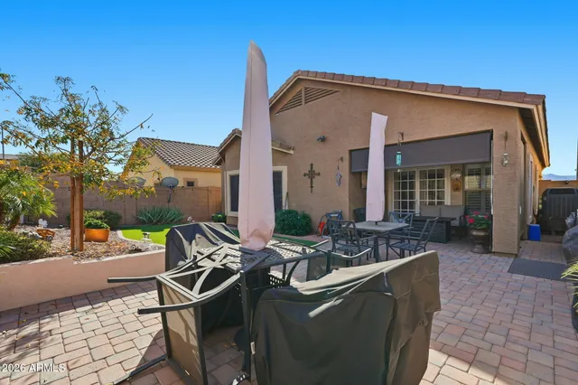 a front view of a house with garden and porch