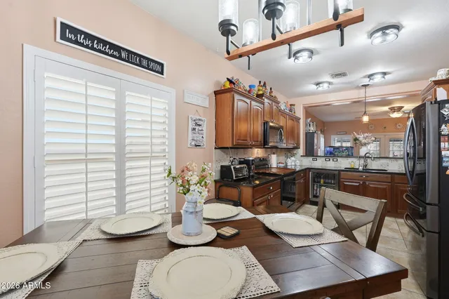 a kitchen with stainless steel appliances kitchen island granite countertop a sink and cabinets