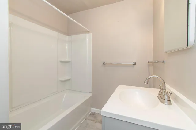 a bathroom with a sink toilet and vanity
