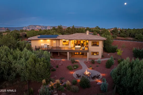 an aerial view of house with yard swimming pool and outdoor seating