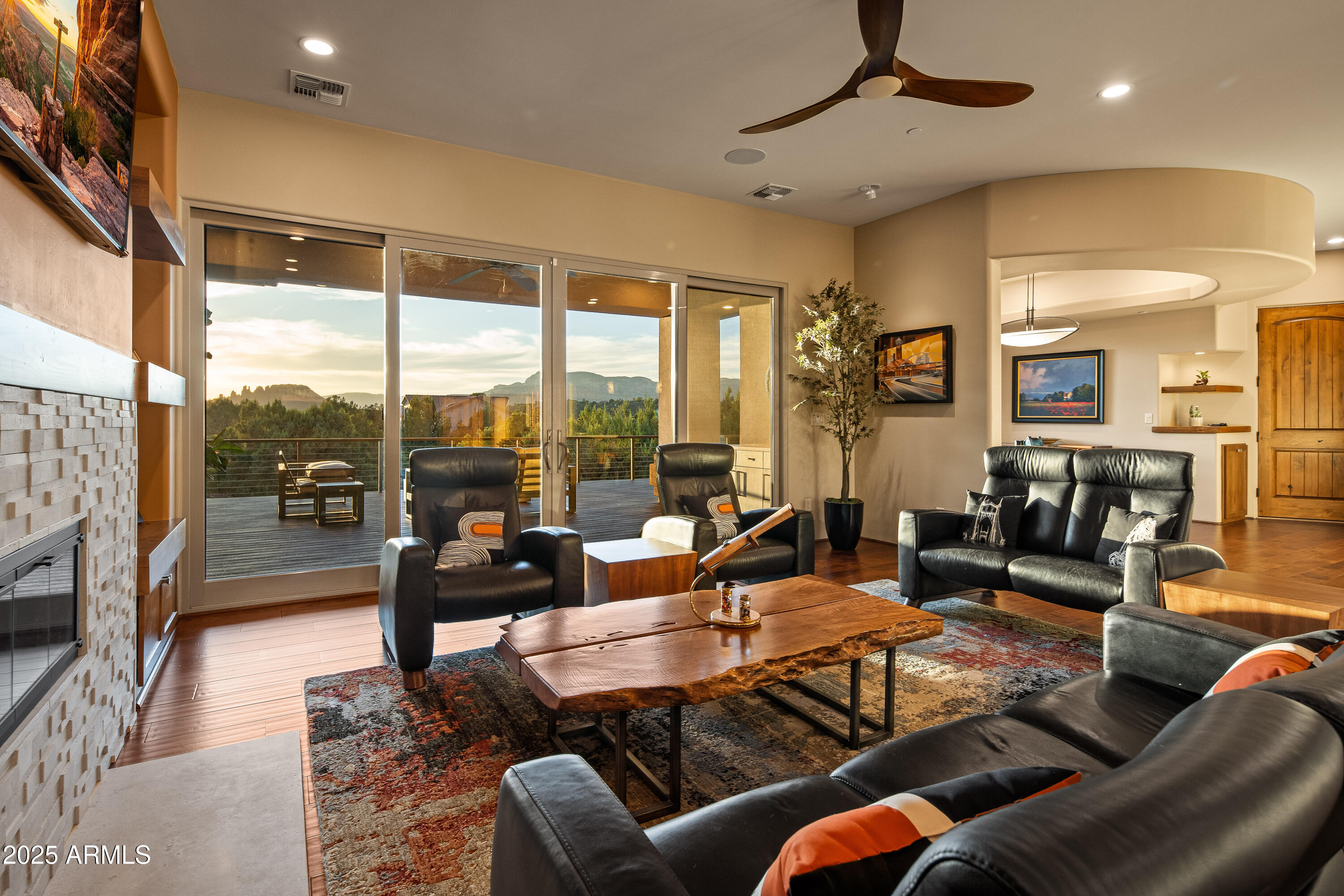150 Rimstone Circle Sedona, AZ 86336 - Photo 12 of 38 a living room with furniture and a floor to ceiling window