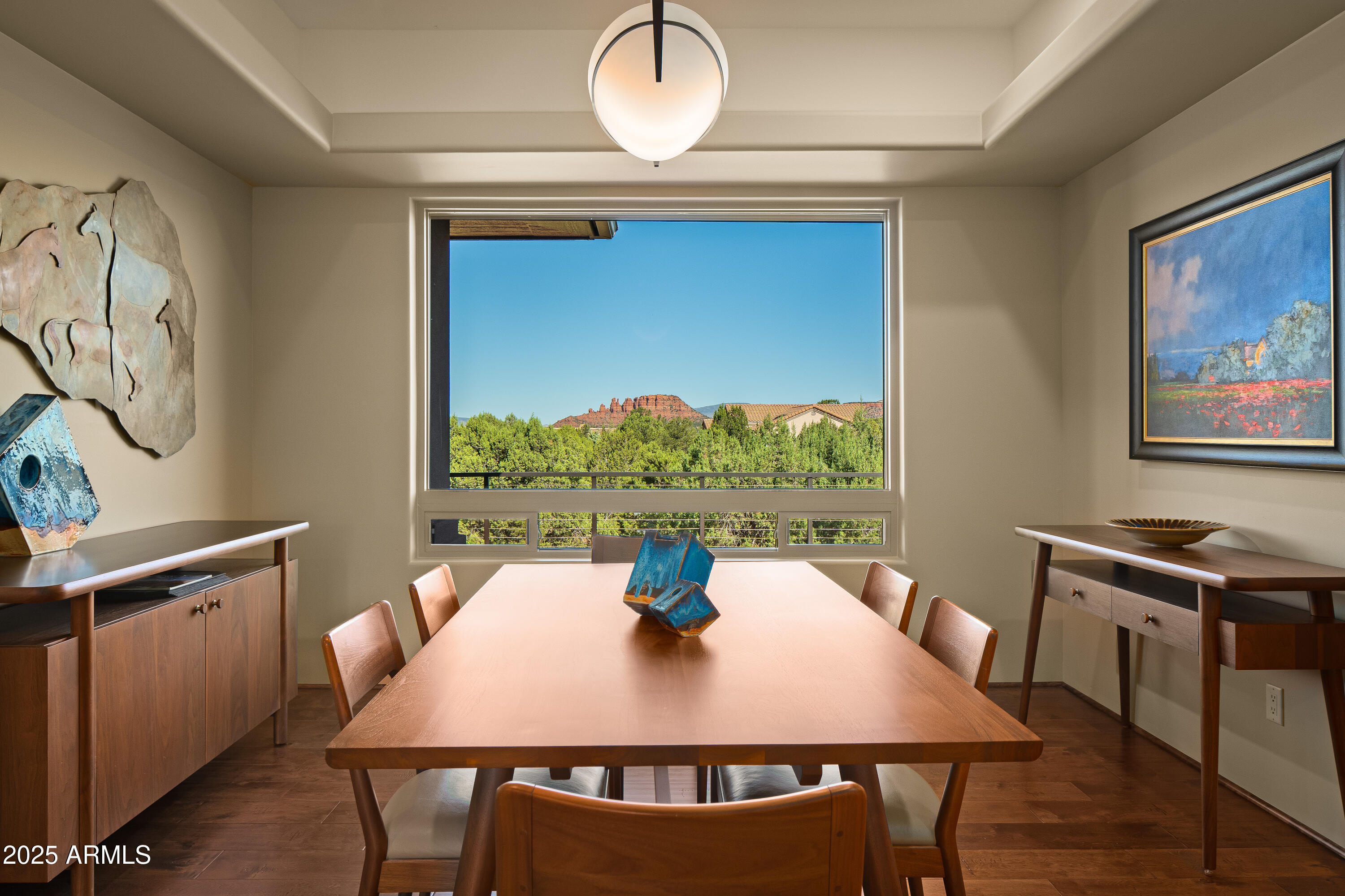 150 Rimstone Circle Sedona, AZ 86336 - Photo 13 of 38 a view of a dining room with furniture window and wooden floor