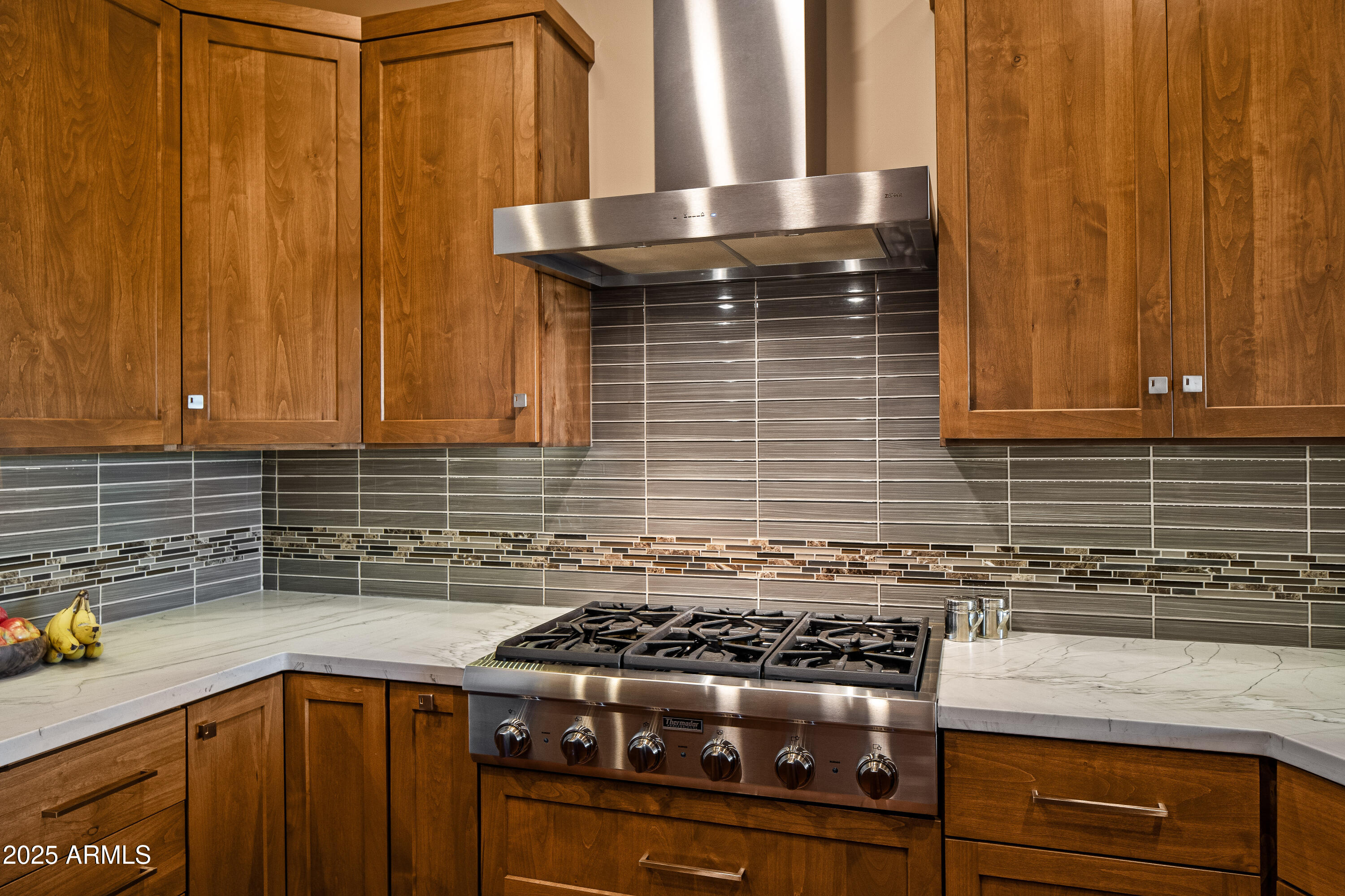 150 Rimstone Circle Sedona, AZ 86336 - Photo 17 of 38 a kitchen with granite countertop a stove sink and cabinets