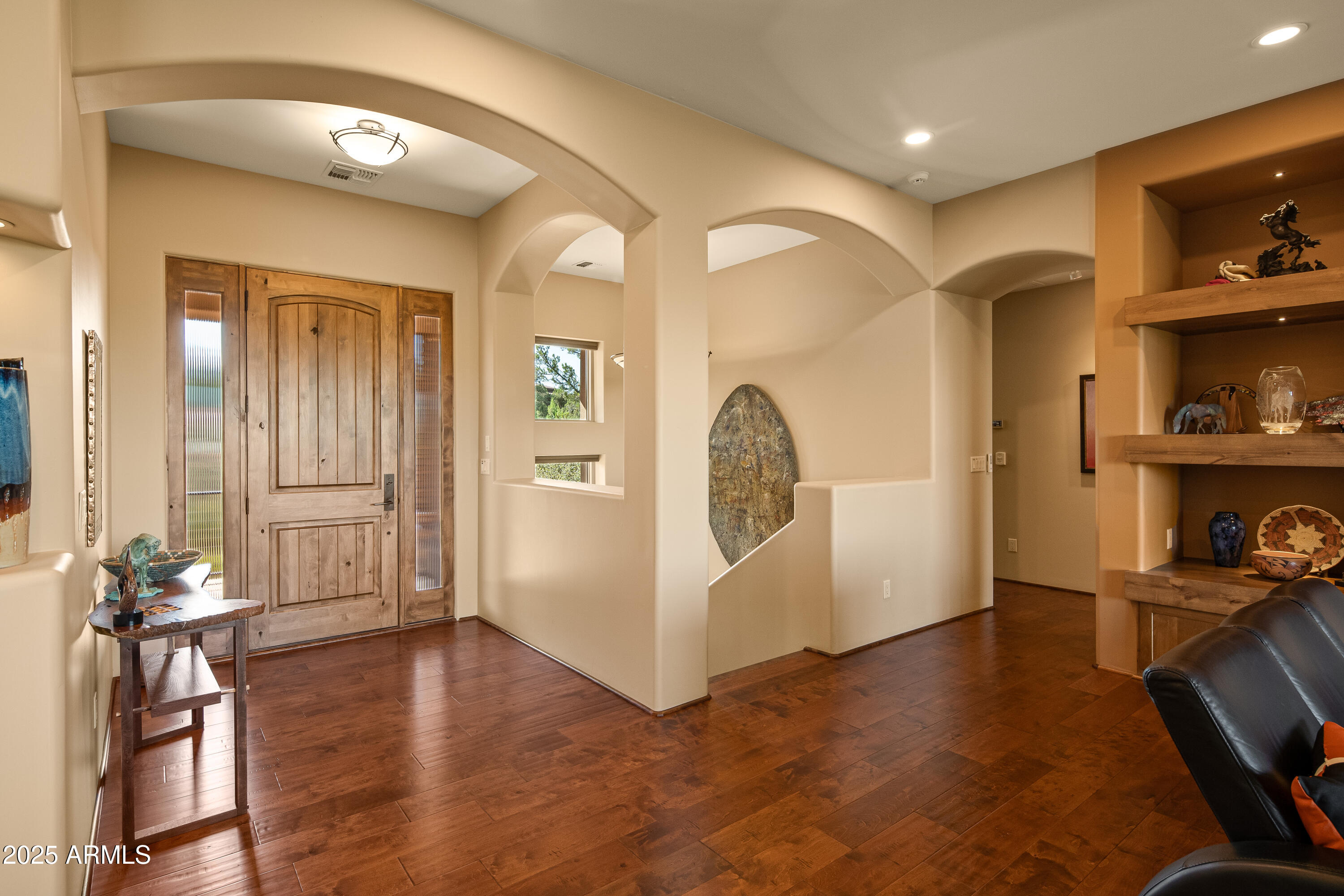 150 Rimstone Circle Sedona, AZ 86336 - Photo 18 of 38 a view of a livingroom with furniture and wooden floor