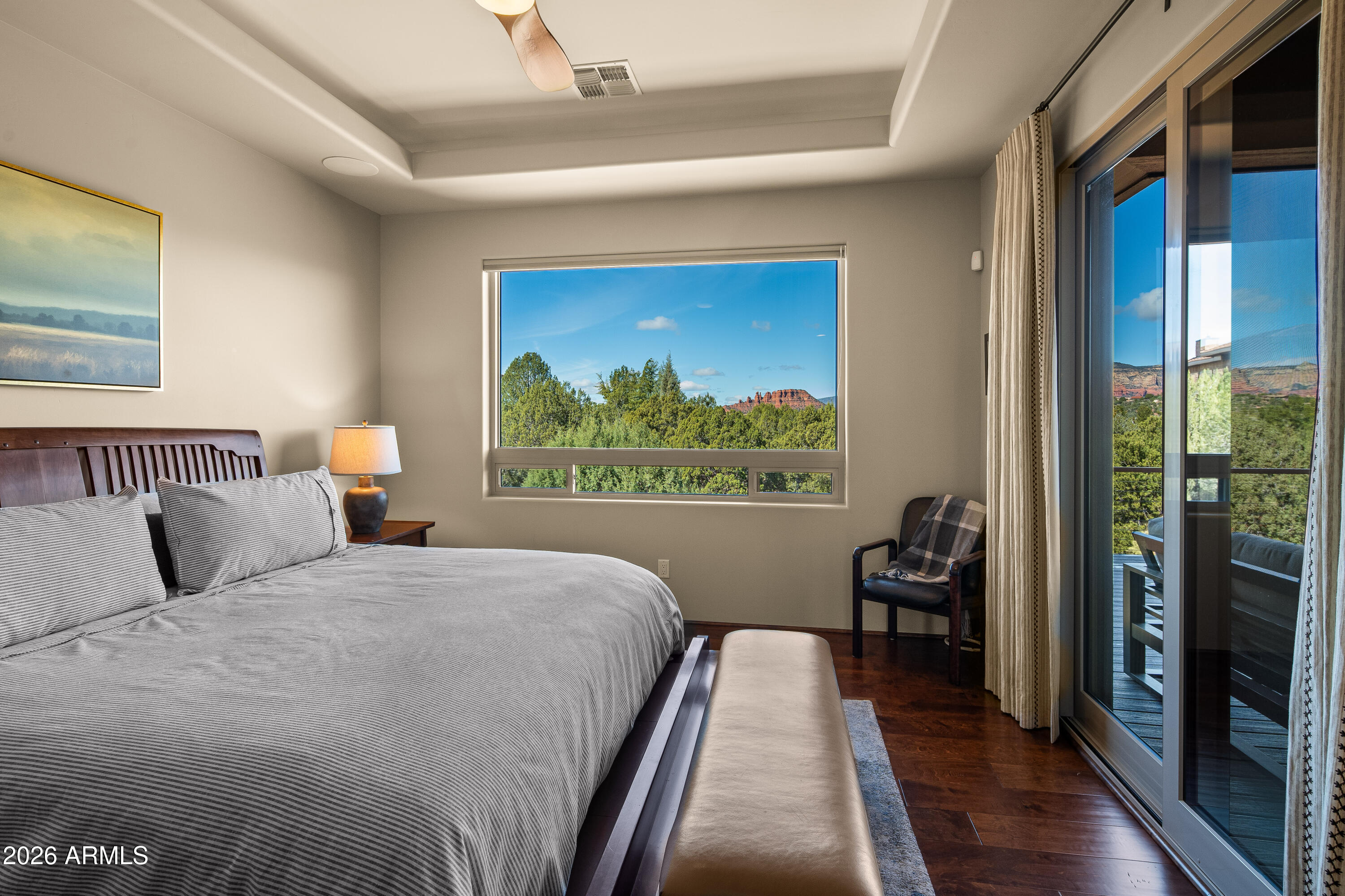 150 Rimstone Circle Sedona, AZ 86336 - Photo 21 of 38 a bedroom with a bed and a large window