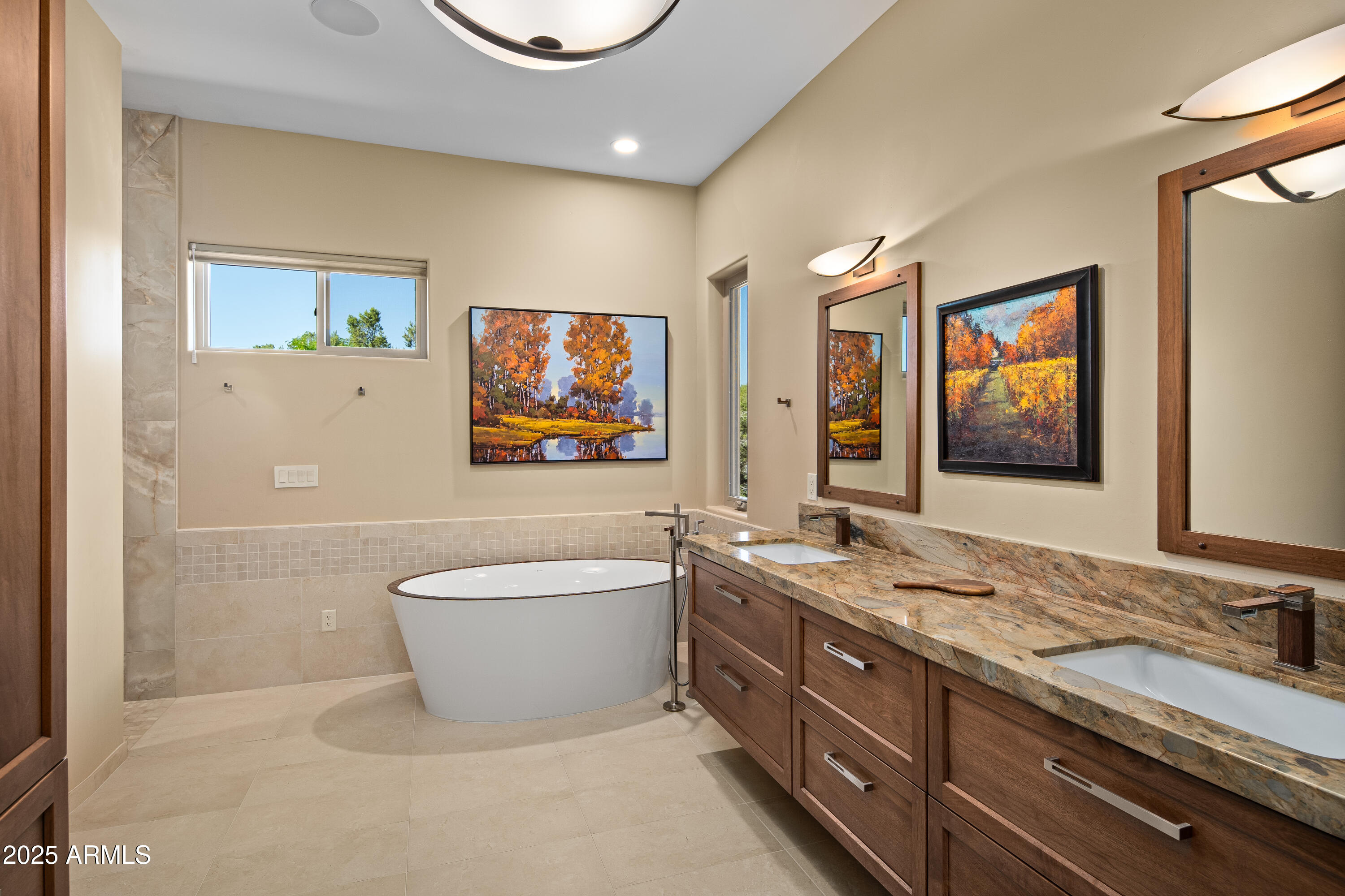 150 Rimstone Circle Sedona, AZ 86336 - Photo 22 of 38 a bath room with a sink a mirror and a bathtub