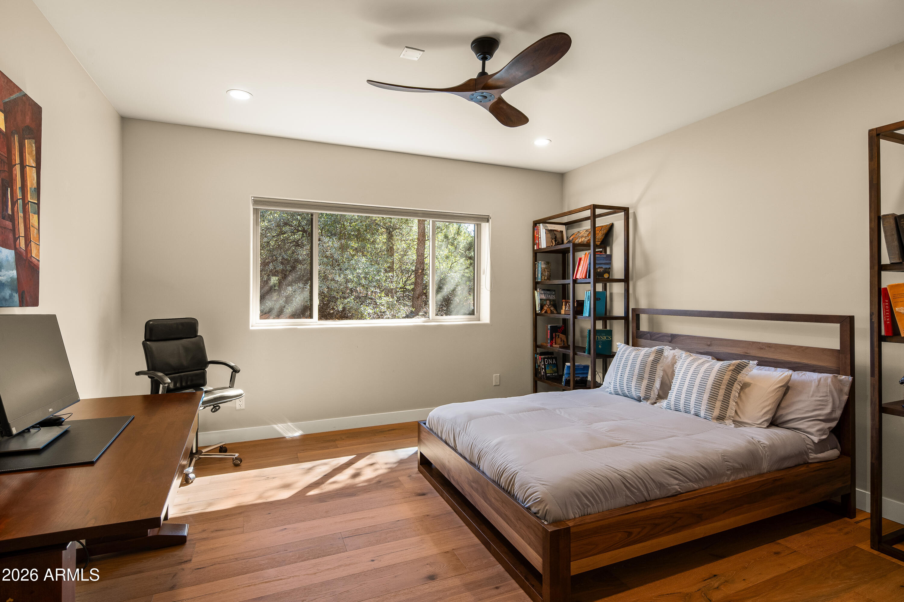 150 Rimstone Circle Sedona, AZ 86336 - Photo 24 of 38 a bedroom with a large bed and a desk