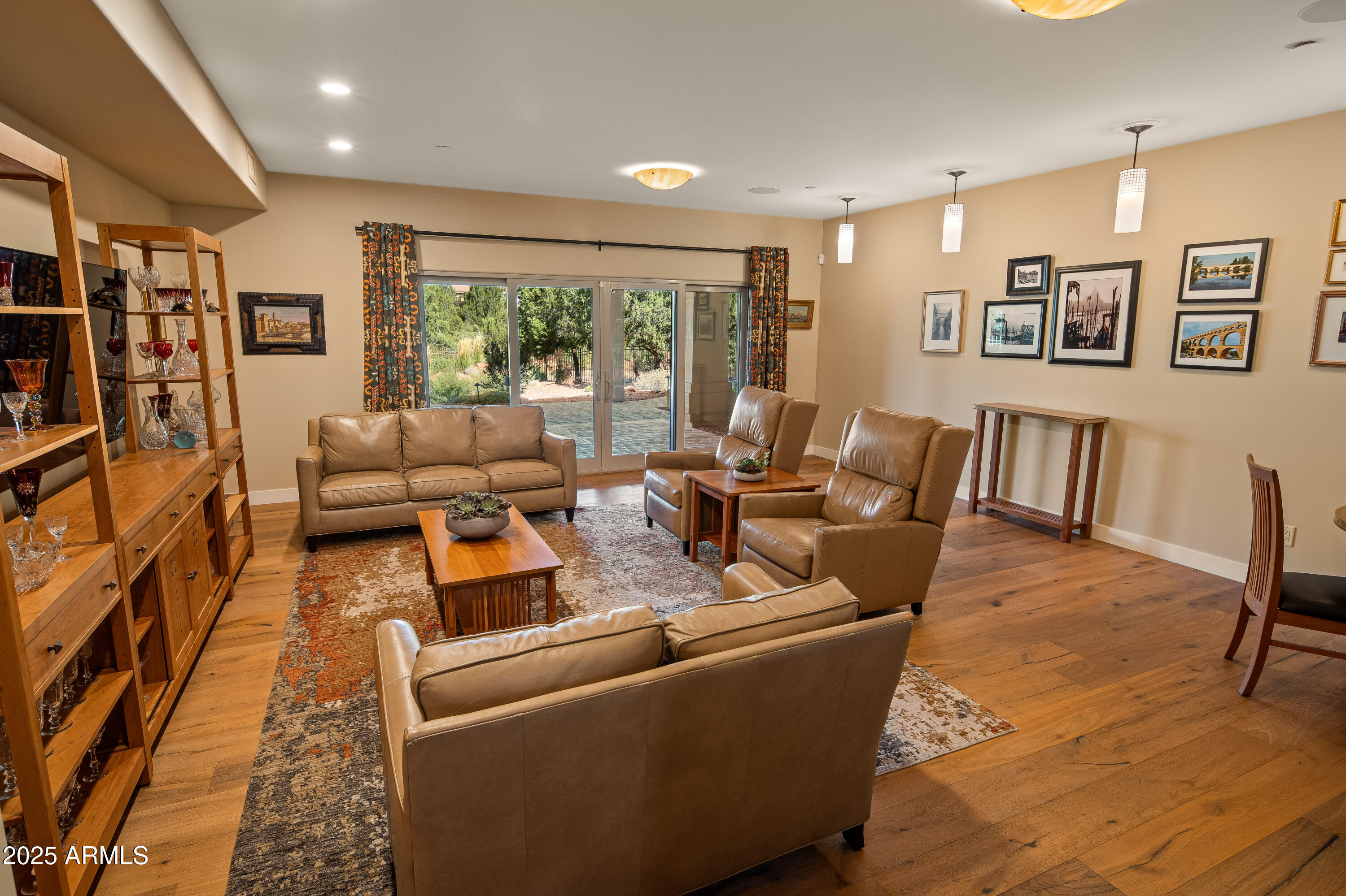 150 Rimstone Circle Sedona, AZ 86336 - Photo 26 of 38 a living room with furniture and a flat screen tv