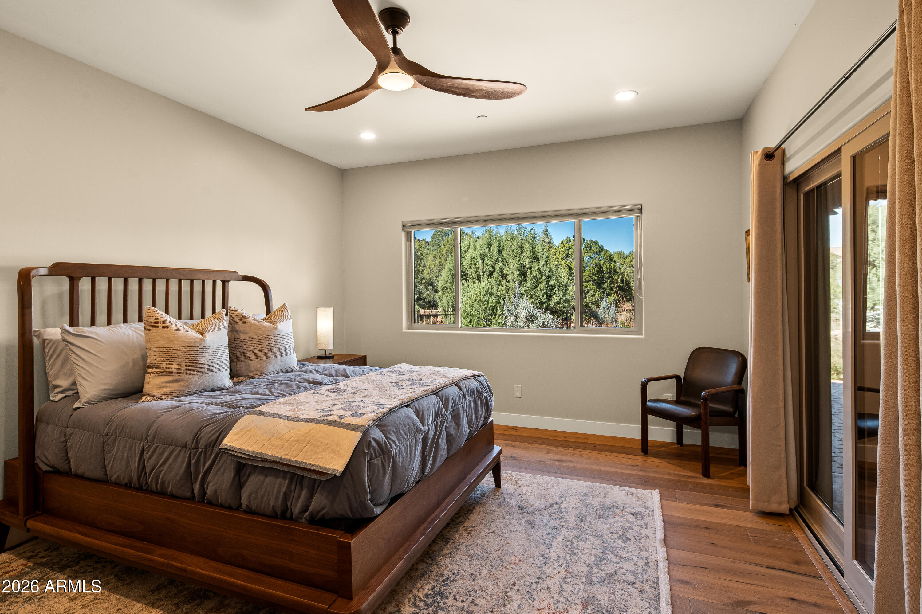 150 Rimstone Circle Sedona, AZ 86336 - Photo 27 of 38 a bedroom with a bed and a window