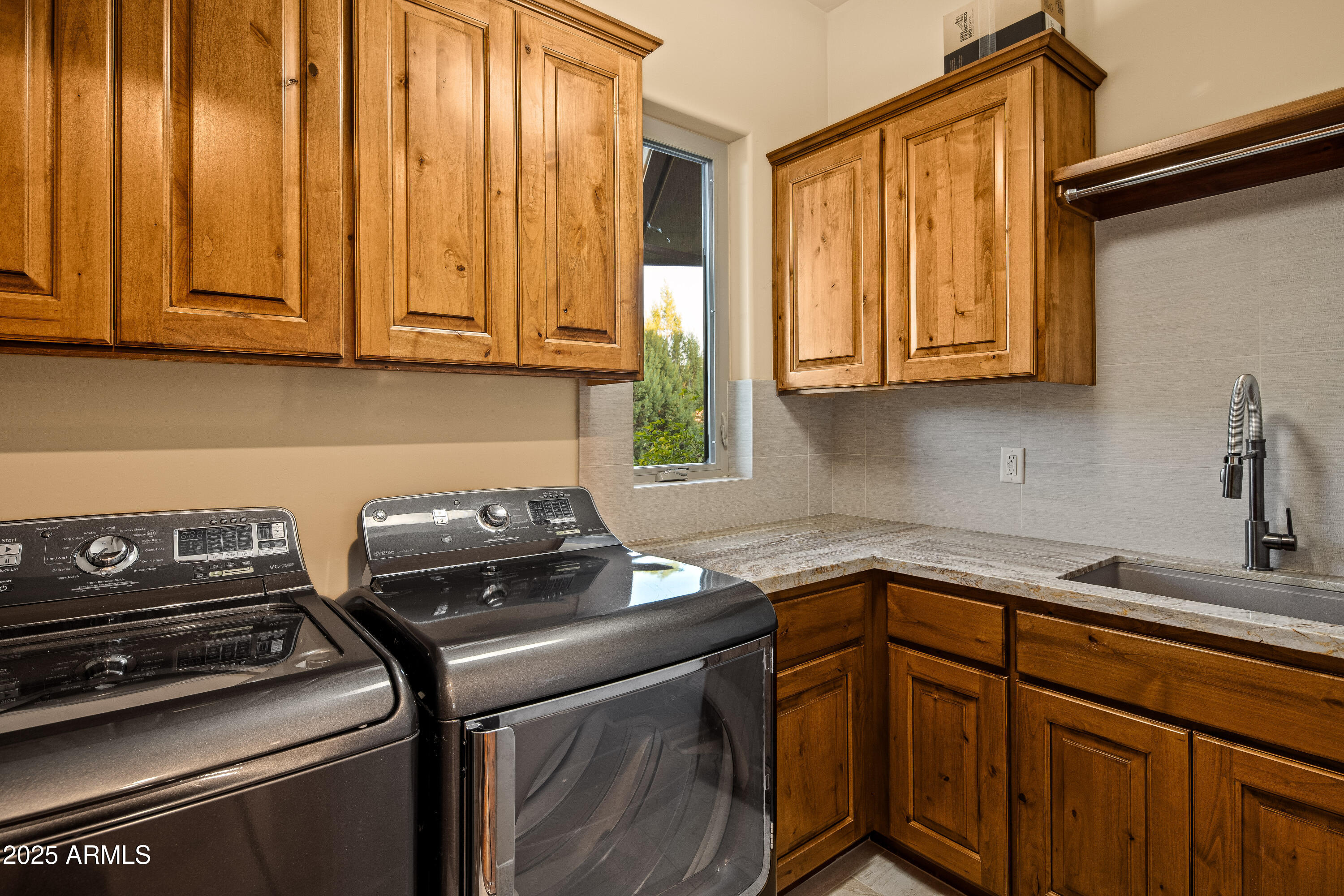 150 Rimstone Circle Sedona, AZ 86336 - Photo 31 of 38 a kitchen with granite countertop cabinets stainless steel appliances and a sink
