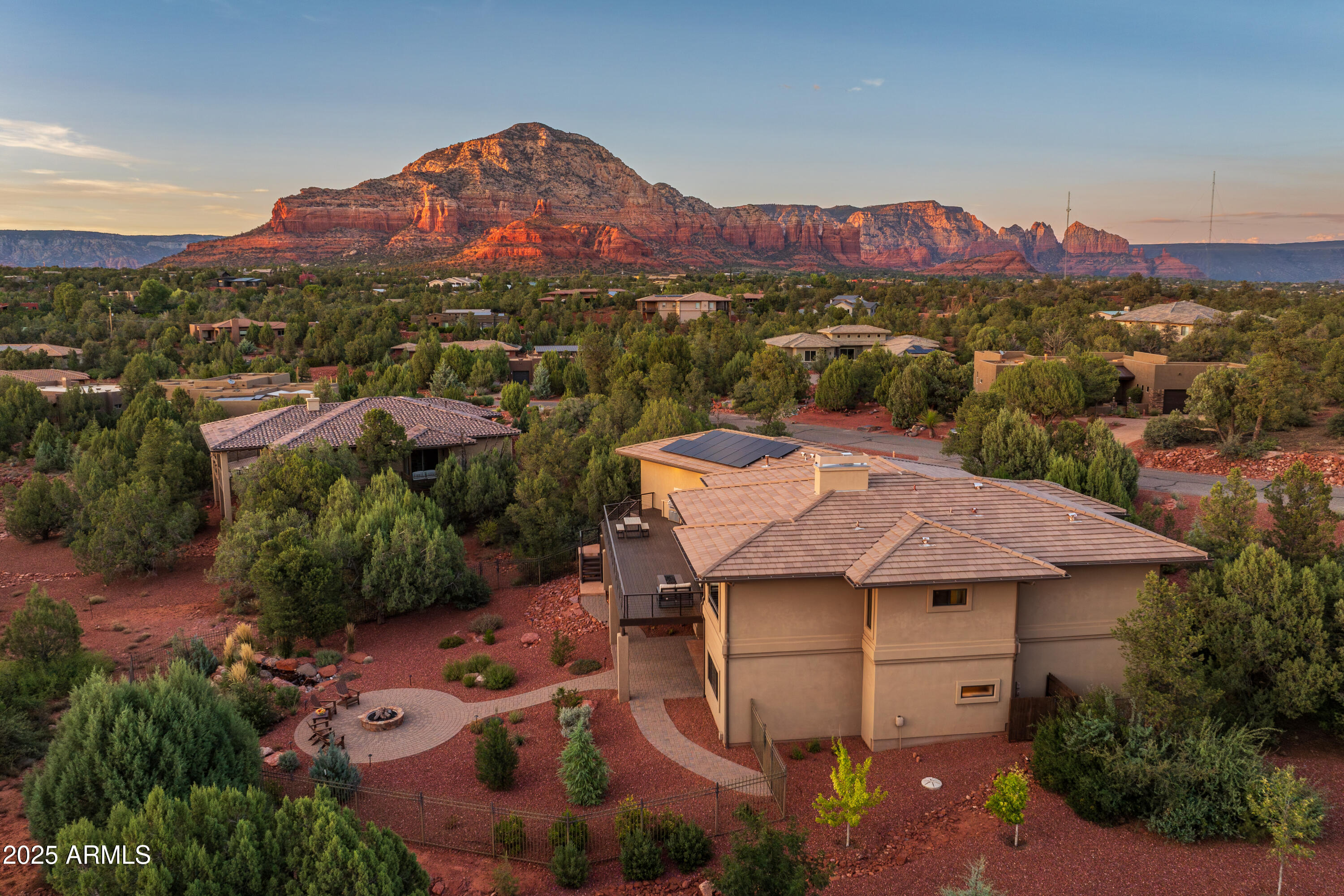 150 Rimstone Circle Sedona, AZ 86336 - Photo 9 of 38 an aerial view of a house with a mountain in the background