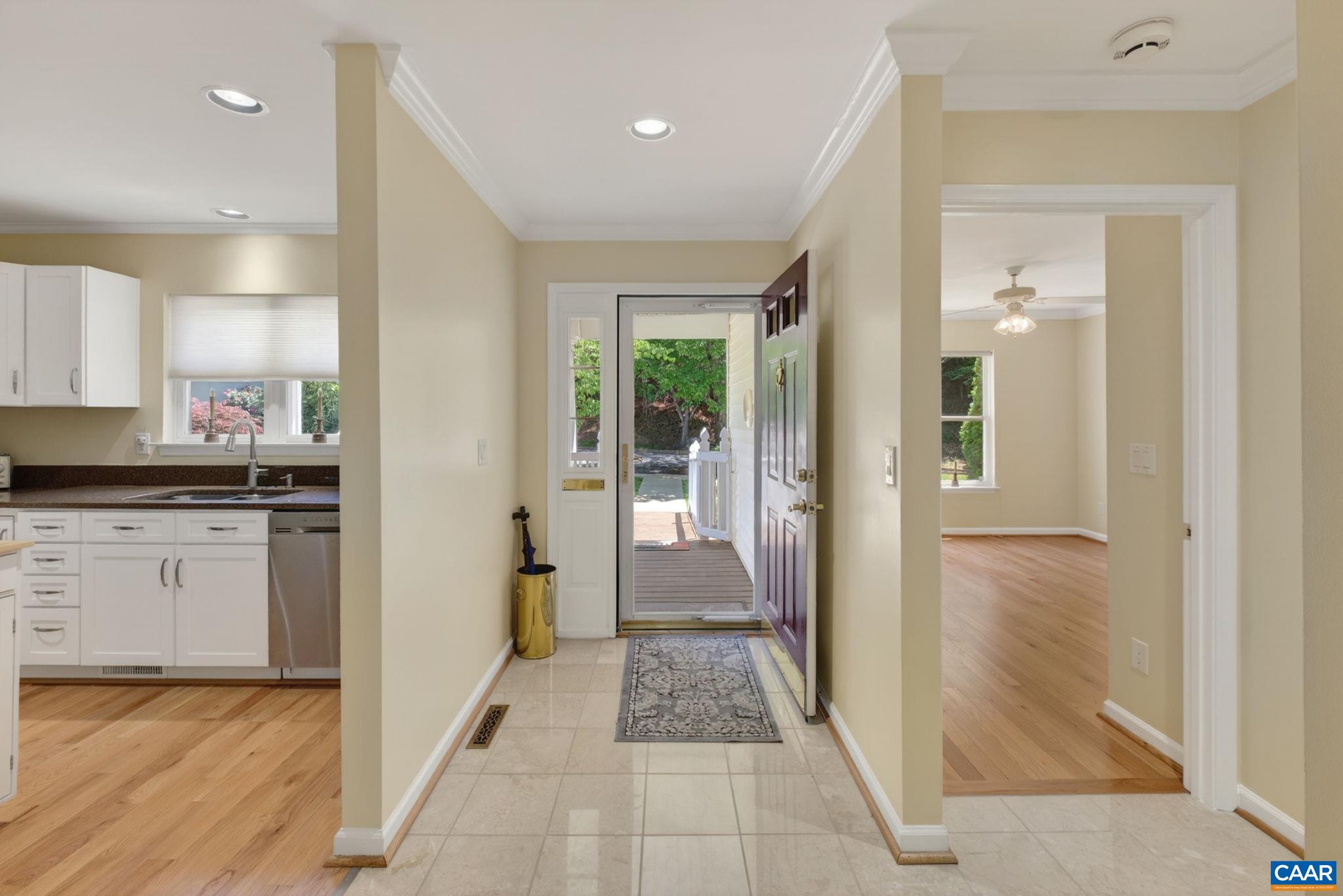 590 Mockingbird Way Charlottesville, VA 22901 - Photo 5 of 43 a view of a hallway with white cabinets and wooden floor
