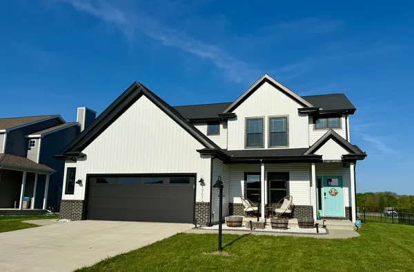 a front view of a house with a yard