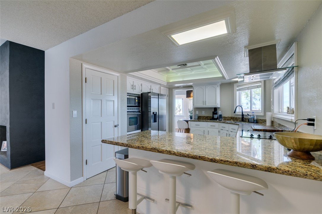 892 North Hollywood Boulevard Las Vegas, NV 89110 - Photo 11 of 81 This bright kitchen features a spacious island, built-in appliances, and ample natural light.