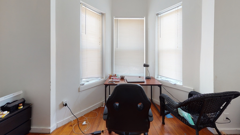 11 Forbes Street, Unit 2 Boston, MA 02130 - Photo 11 of 17 a living room with furniture and a window