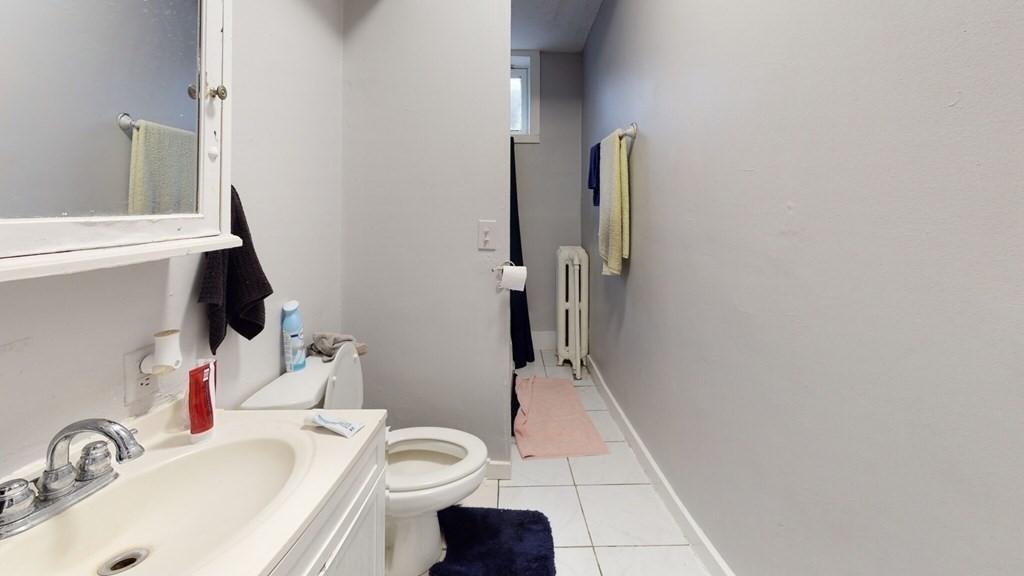 11 Forbes Street, Unit 2 Boston, MA 02130 - Photo 14 of 17 a bathroom with a sink and toilet