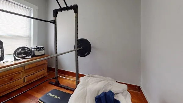 a bedroom with a bed and cabinets