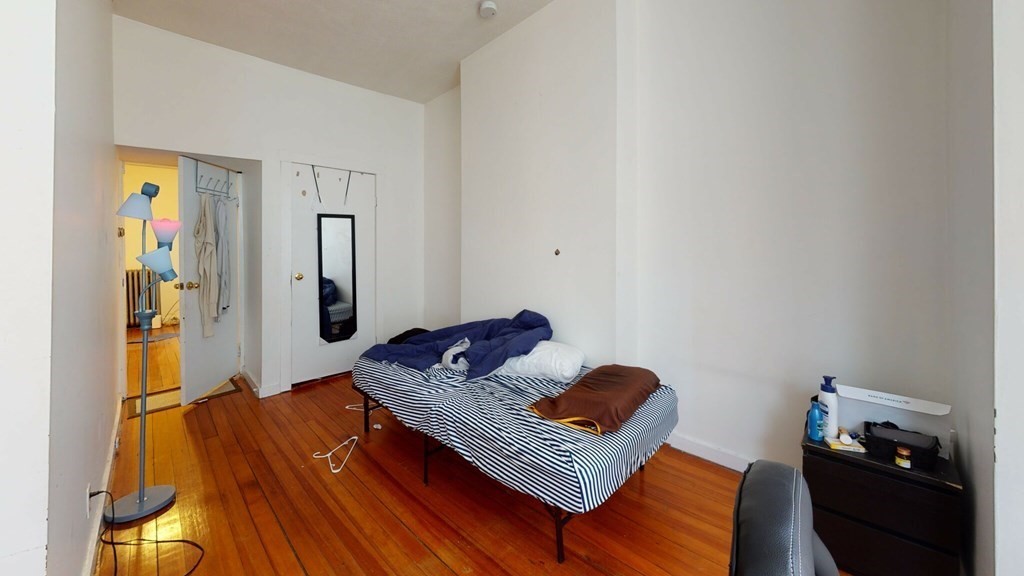 11 Forbes Street, Unit 2 Boston, MA 02130 - Photo 7 of 17 a living room with furniture and a wooden floor