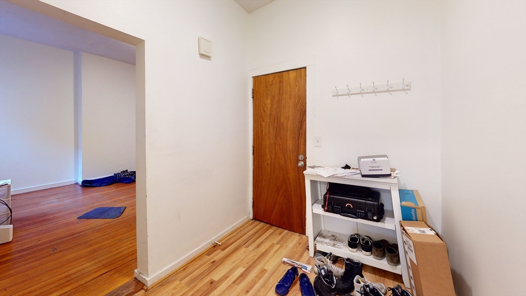 11 Forbes Street, Unit 2 Boston, MA 02130 - Photo 10 of 17 a room with wooden floor and shoes