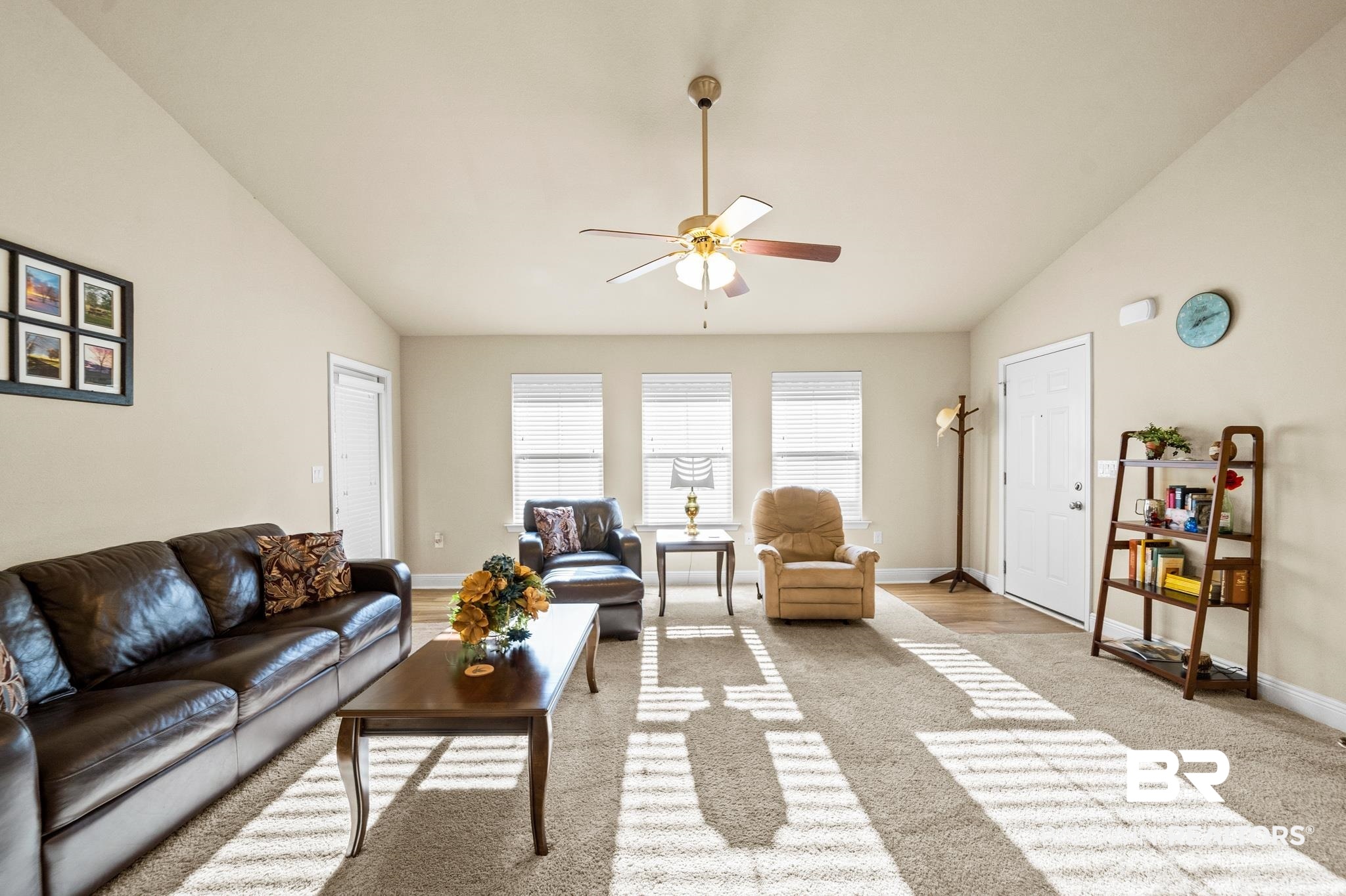 17069 Russet Court Foley, AL 36535 - Photo 6 of 27 Living room featuring ceiling fan, vaulted ceiling, and light carpet