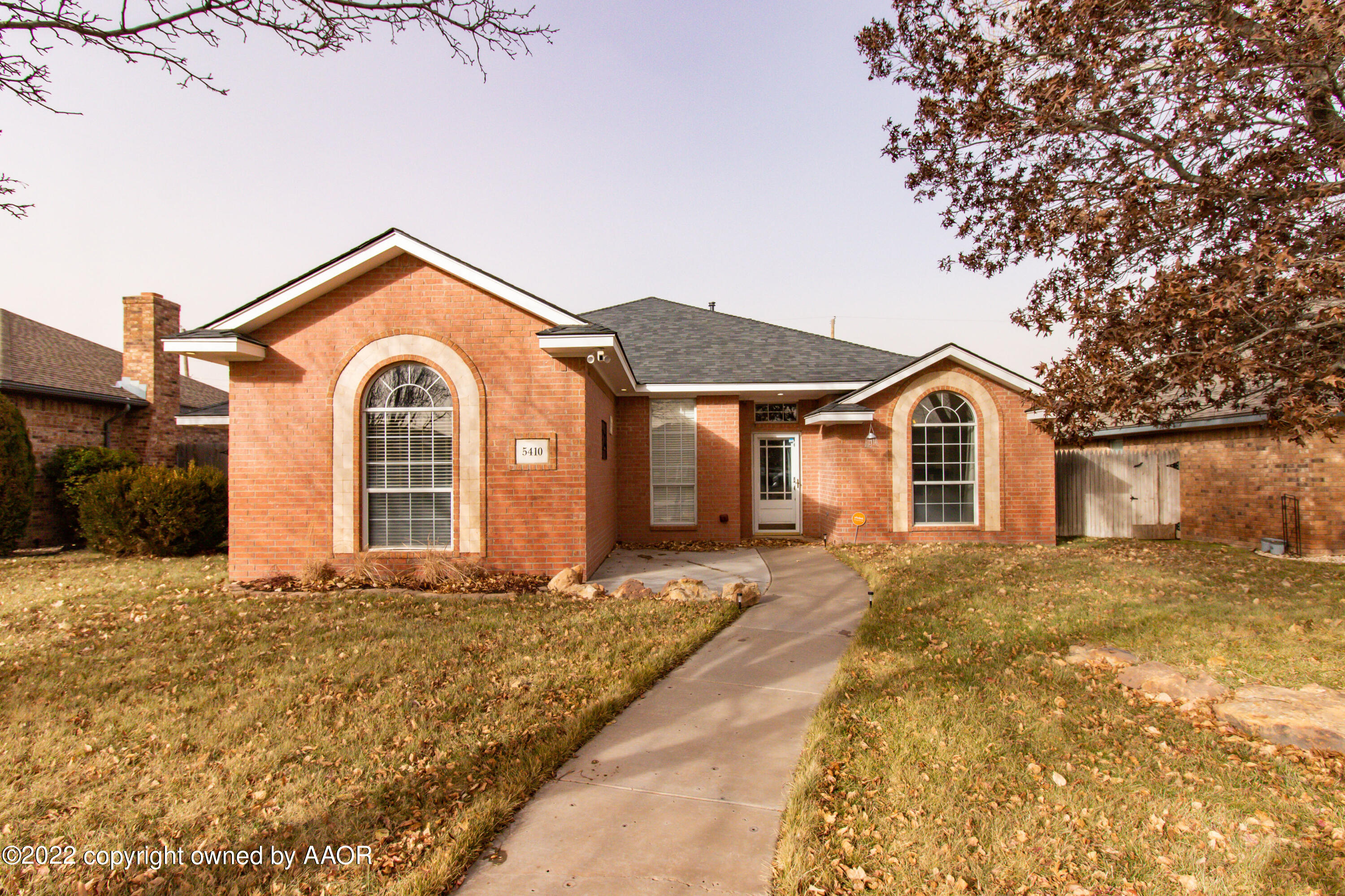 5410 Leo Lane Amarillo, TX 79110 - Photo 1 of 33 a front view of a house with a yard