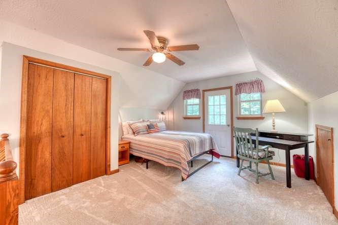 3333 Ellington Road Hayesville, NC 28904 - Photo 44 of 56 a bed room with a bed and a chandelier