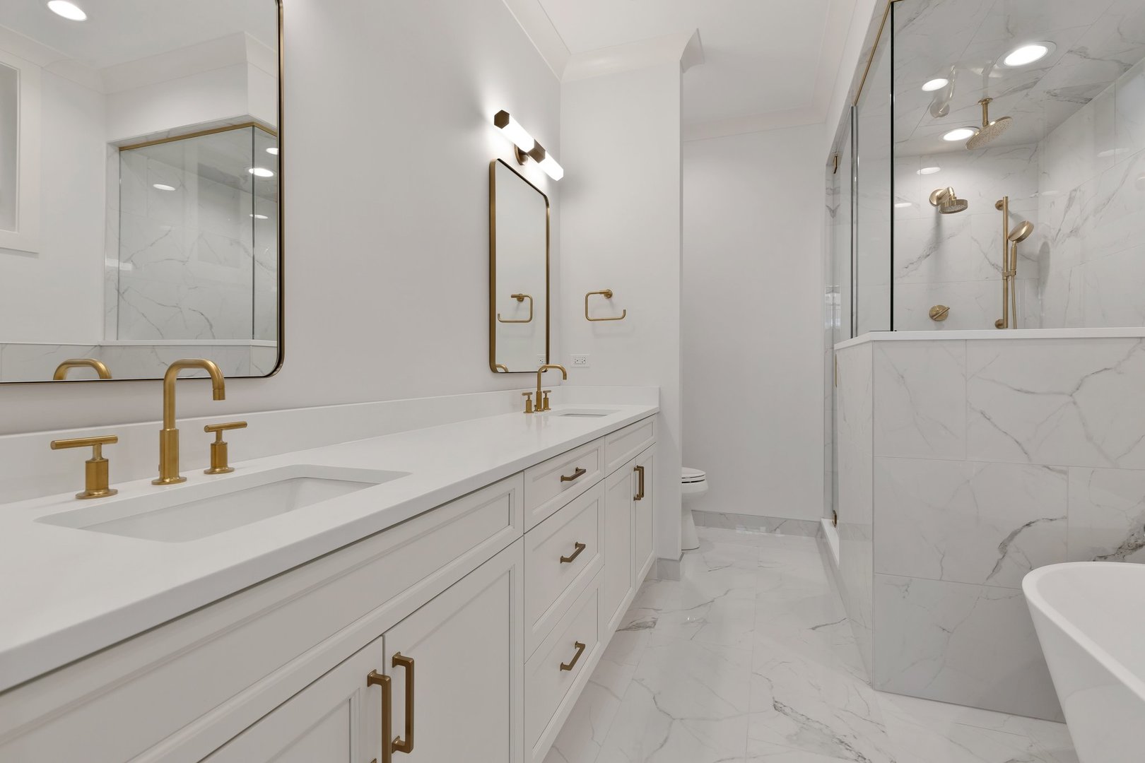 909 West Fletcher Street, Unit 1 Chicago, IL 60657 - Photo 13 of 22 a spacious bathroom with double sink and a mirror
