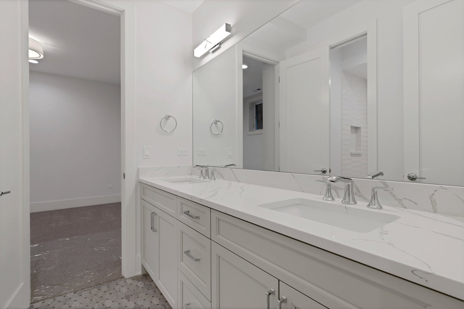 909 West Fletcher Street, Unit 1 Chicago, IL 60657 - Photo 17 of 22 a bathroom with a double vanity sink and a mirror
