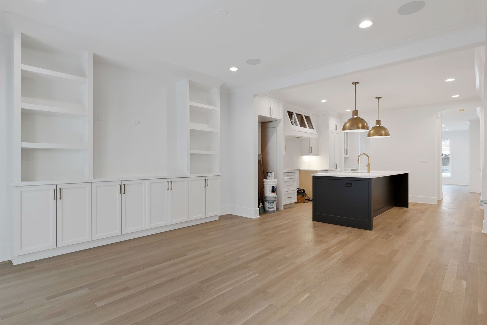 909 West Fletcher Street, Unit 1 Chicago, IL 60657 - Photo 6 of 22 a view of a kitchen with kitchen island microwave and wooden floor