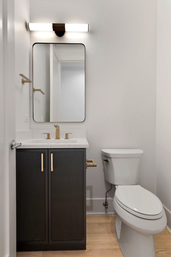 909 West Fletcher Street, Unit 1 Chicago, IL 60657 - Photo 9 of 22 a bathroom with a sink vanity and toilet