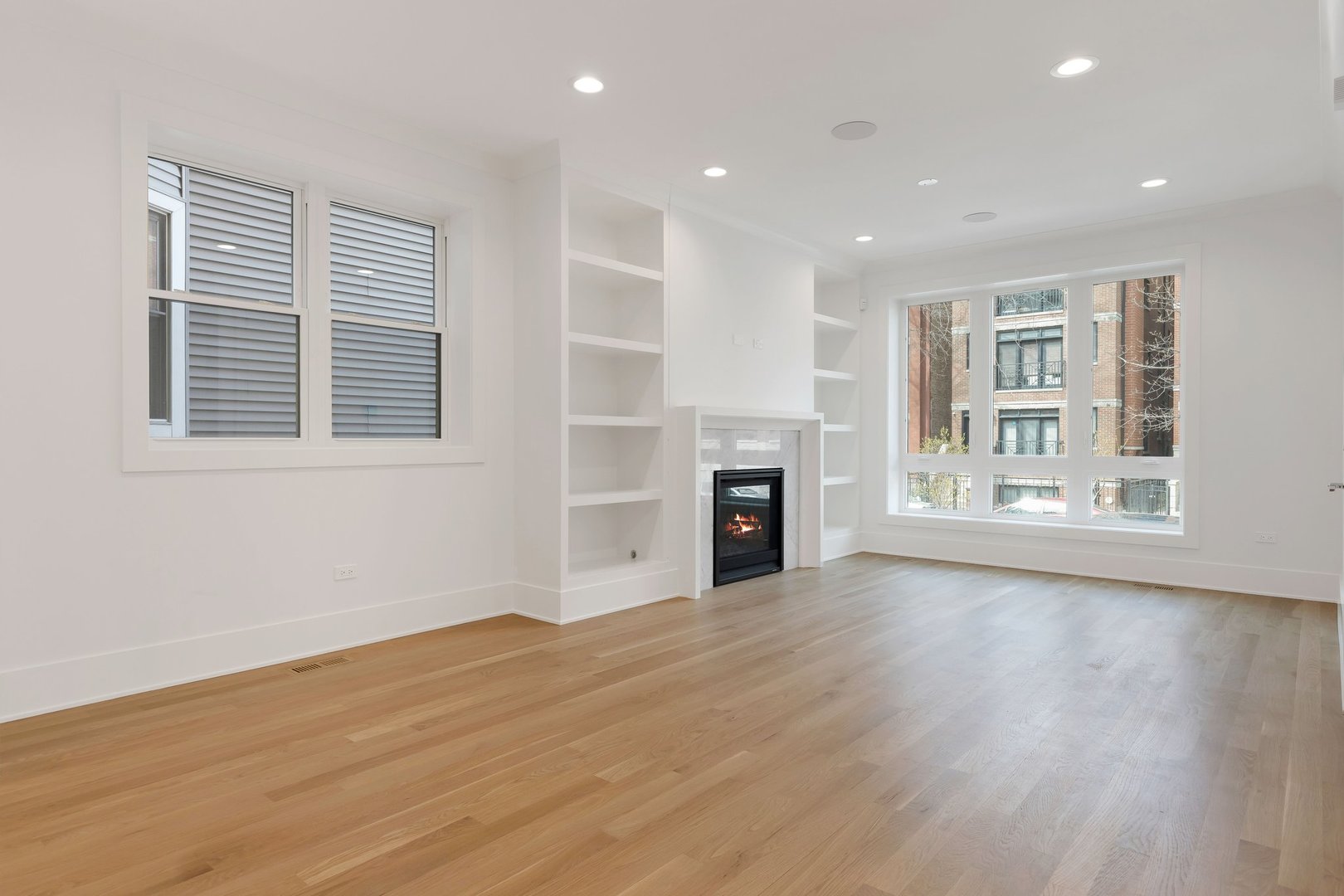 909 West Fletcher Street, Unit 1 Chicago, IL 60657 - Photo 10 of 22 a view of an empty room with wooden floor and a window