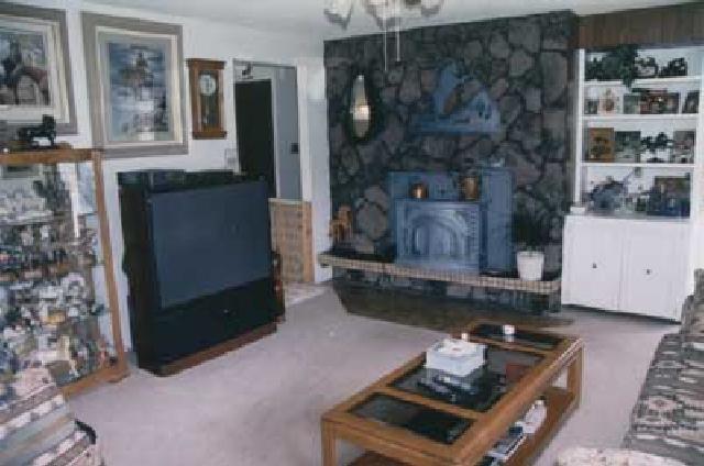 500 Livengood Road Cowiche, WA 98923 - Photo 4 of 9 a living room with furniture and a fireplace