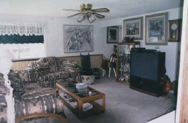 500 Livengood Road Cowiche, WA 98923 - Photo 5 of 9 a living room with furniture a chandelier and a window