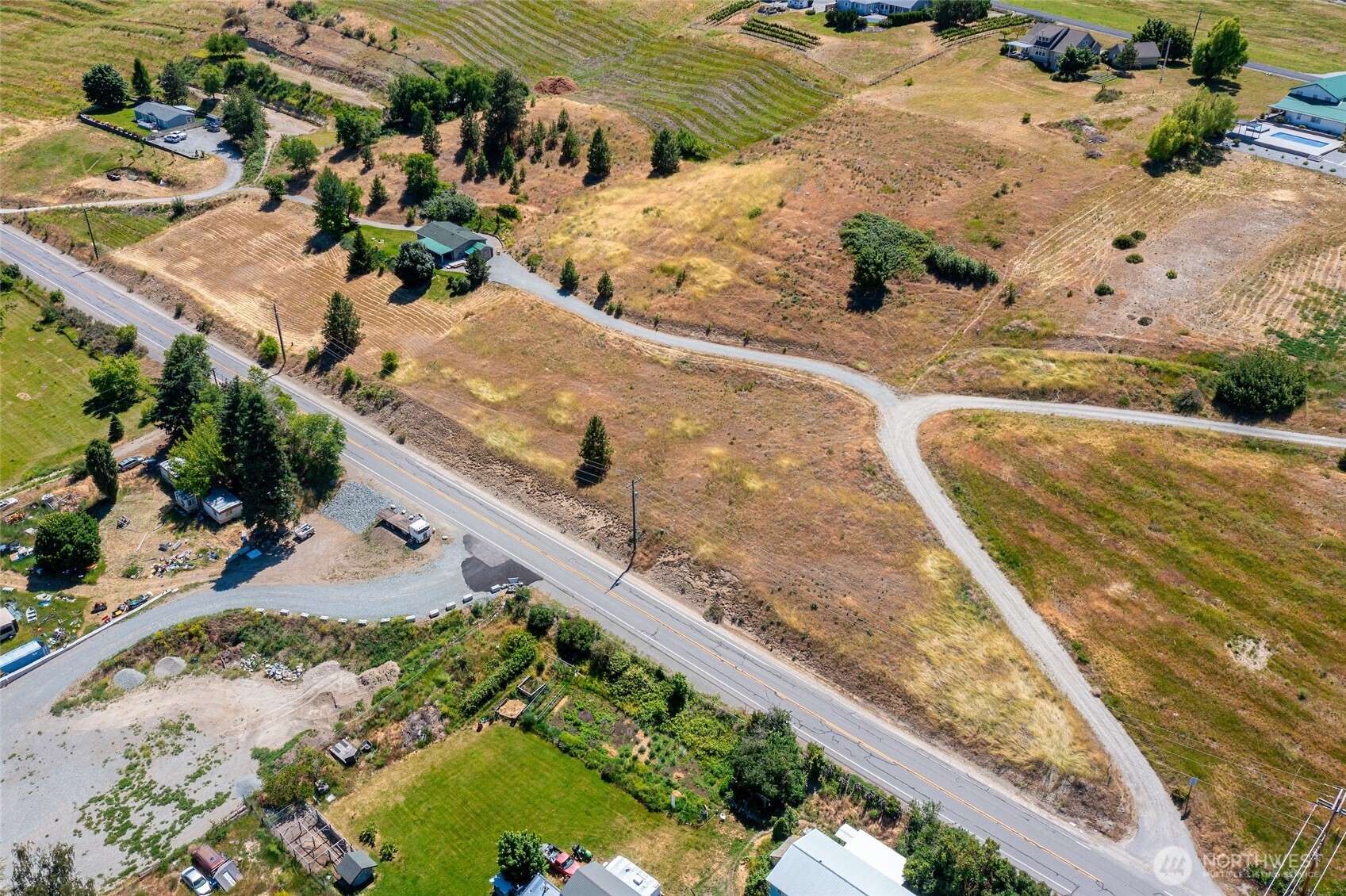 32 Barkley Road Manson, WA 98831 - Photo 5 of 17 a view of a yard with wooden floor