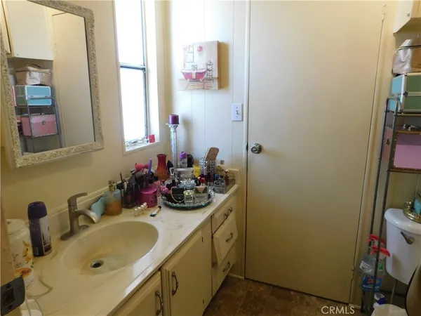 a view of storage and utility room with washer and dryer