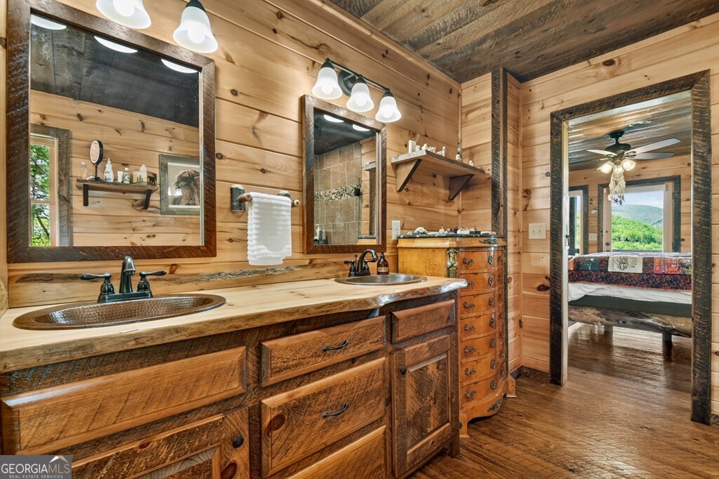 459 Quail Ridge Road Epworth, GA 30541 - Photo 31 of 73 a bathroom with a sink and a mirror