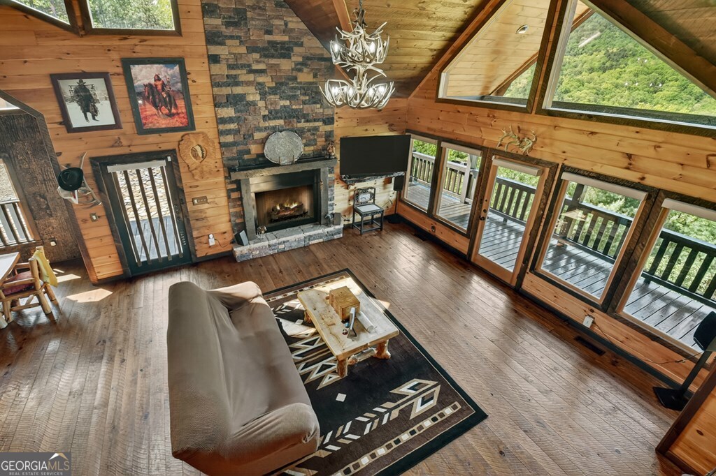 459 Quail Ridge Road Epworth, GA 30541 - Photo 40 of 73 a living room with furniture fireplace and flat screen tv
