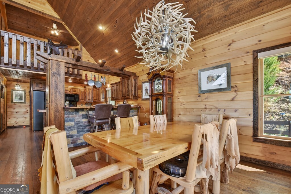 459 Quail Ridge Road Epworth, GA 30541 - Photo 43 of 73 a view of a dining room with furniture window and wooden floor